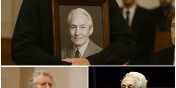 The chapel fell into a reverent hush when Robert Plant quietly stepped forward at Charlie Watts’ funeral, dressed in a simple black suit with his iconic golden curls tied loosely back, and stood beside the…