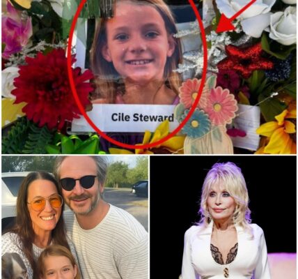 BREAKING: Dolly Parton met the parents of the last girl found at Camp Mystic — but when they hugged their daughter, something *inhumanly cold* clung to her back. Only later, under the light, did they *see it*. Full chilling photo in comments.