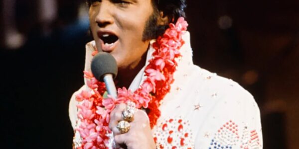 “From Karate Kicks to Rhinestone Glory: The Untold Story Behind Elvis Presley’s Jumpsuits – How a Bold Fashion Gamble Became the King’s Ultimate Stage Weapon, Why His Tailor Protected His Masculinity at All Costs, and the Hidden Symbolism Sewn into Every Stitch”