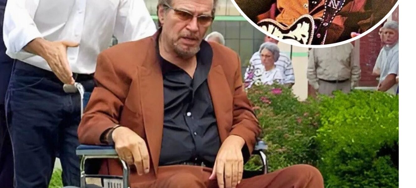 Gone is the Waylon Jennings the world remembers — not the outlaw with a booming voice and a guitar slung across his shoulder, but a man weathered by time, seated in a wheelchair, facing life with the same grit that marked every song he ever sang.