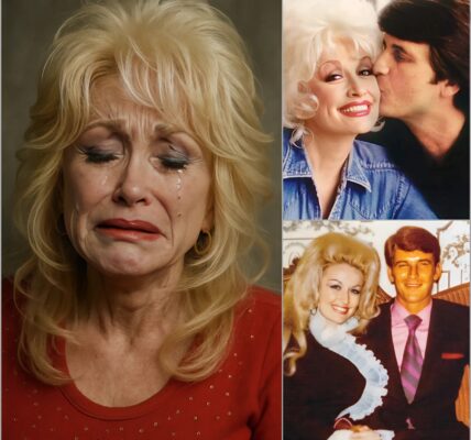 “Can you hear me, darling?” Dolly Parton’s trembling voice filled the Ryman Auditorium — not with fame, but with farewell. Gone were the sequins and smiles; in their place stood a woman singing to the love of her life, Carl Dean, gone after nearly sixty years by her side. She performed a song no one had ever heard — “Still Here in the Quiet” — one Carl had secretly written and left for her to find “when the music hurts too much to start.” Each lyric felt like a heartbeat reaching across eternity. But before leaving the stage, Dolly whispered one last line never heard before — a promise that left the world wondering what she meant, and who it was truly for.