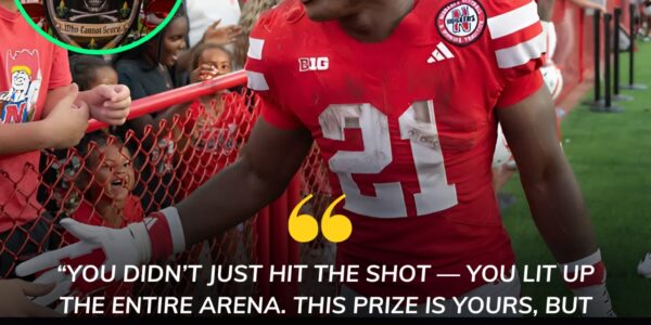 When the Shot Dropped, So Did Every Jaw in the Arena — Emmett Johnson’s $10,000 Surprise Left One Lifelong Nebraska Fan Changed Forever