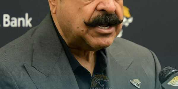 Shad Khan makes a decision regarding the Jaguars' head coach after the opening game loss, vowing to overhaul the team aggressively.